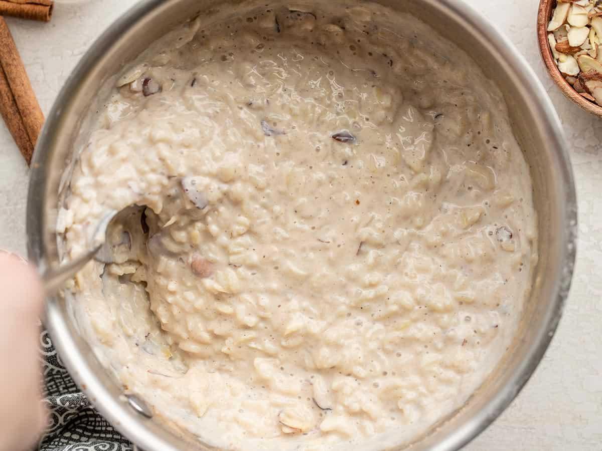 Close-up of creamy rice pudding being stirred in a pot