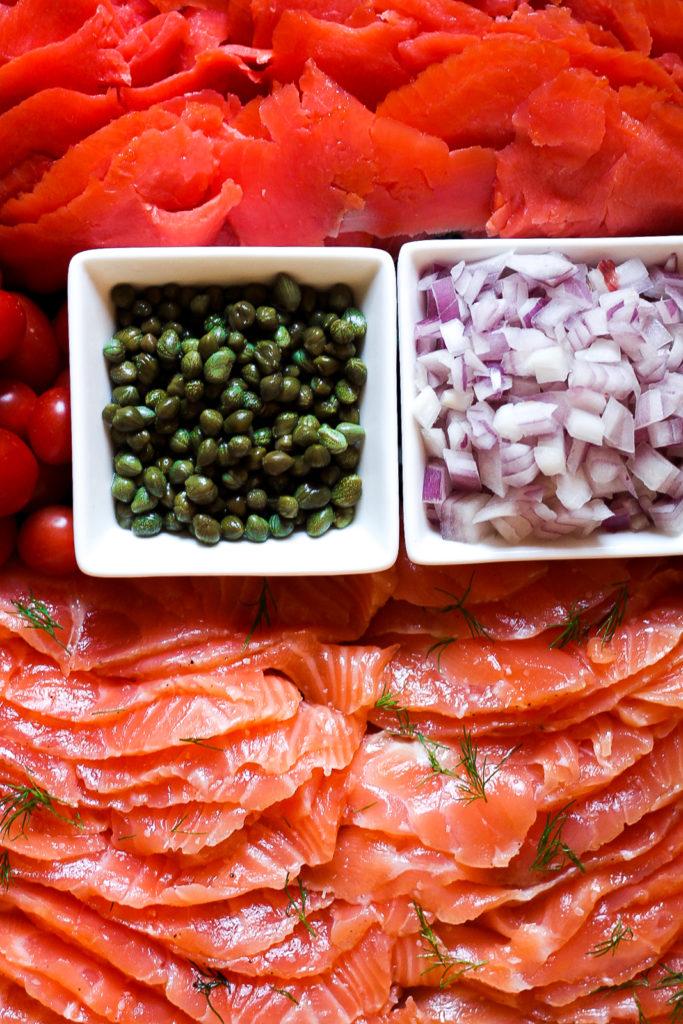 Overhead shot of all ingredients for smoked paprika gravlax laid out on a counter