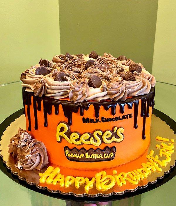 A photo of the peanut butter cup cake being served at a birthday party