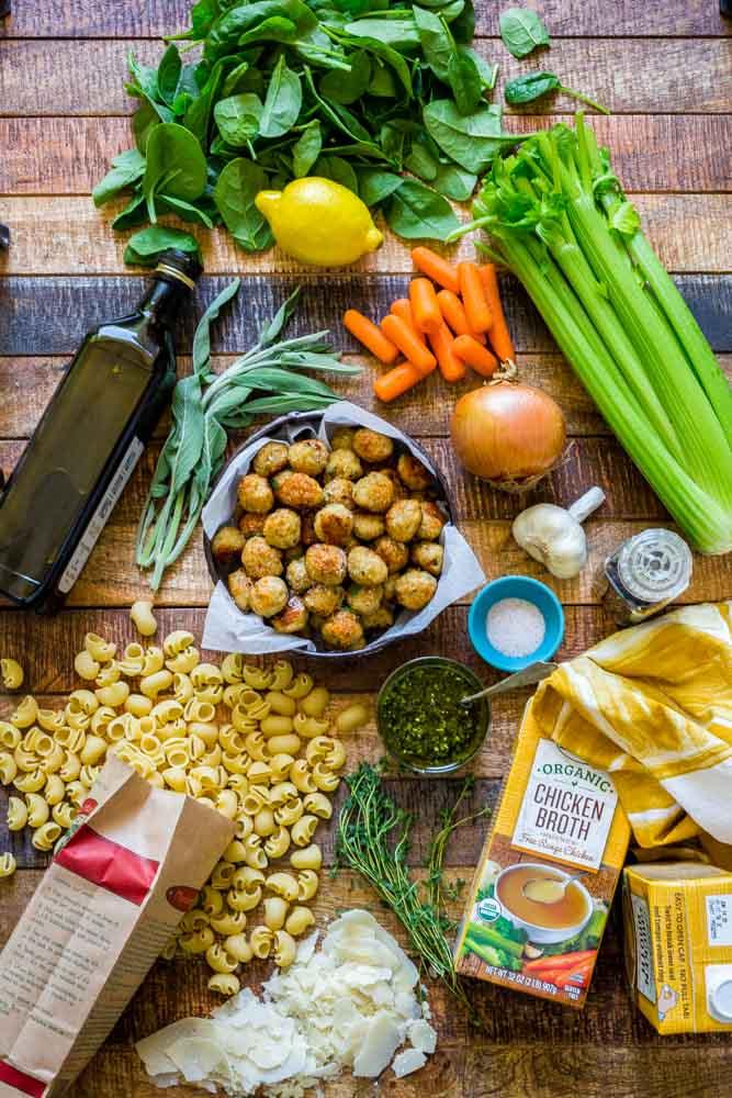 ingredients for Italian Wedding Soup laid out on a wooden surface