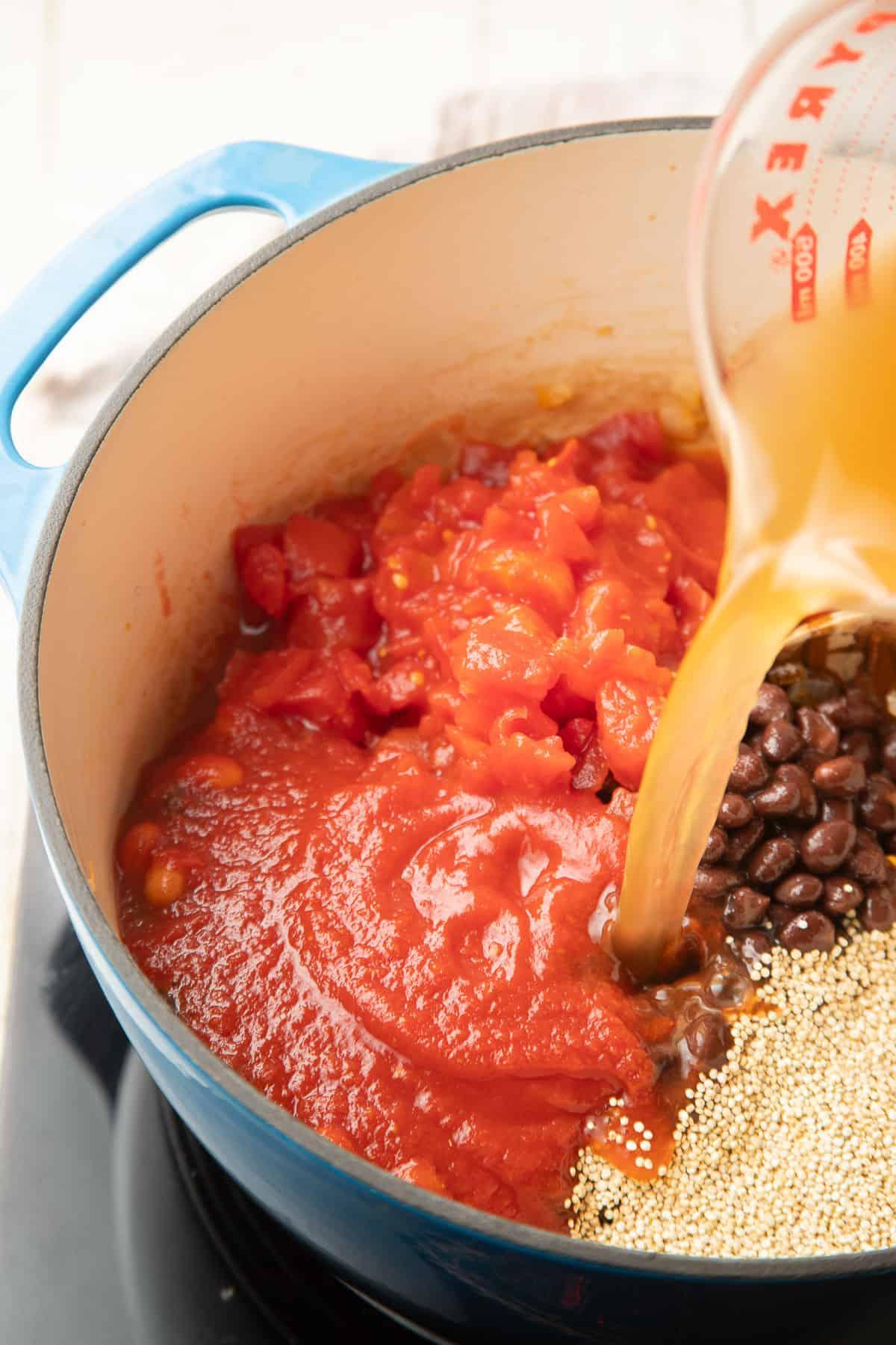 quinoa chili being poured into a bowl