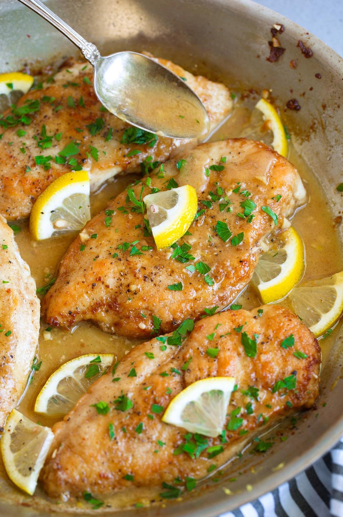 golden pan-seared lemon butter chicken breast with fresh parsley
