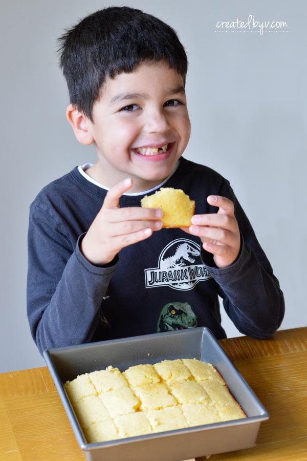 person enjoying a slice of cornbread