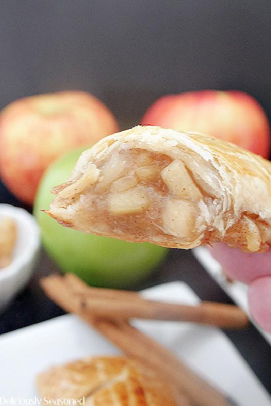 close up of apple cinnamon hand pie being held