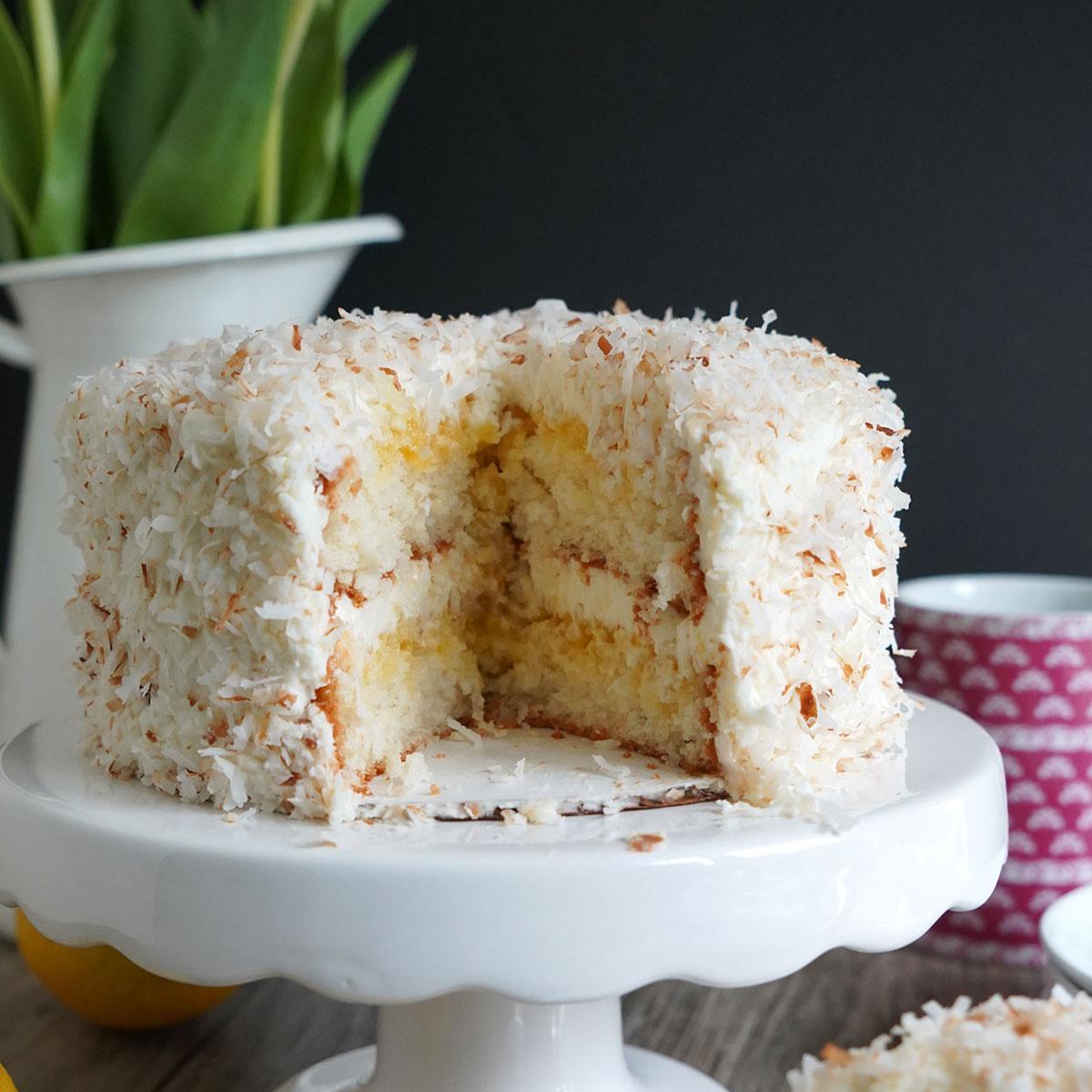 lemon coconut cake with a slice taken out