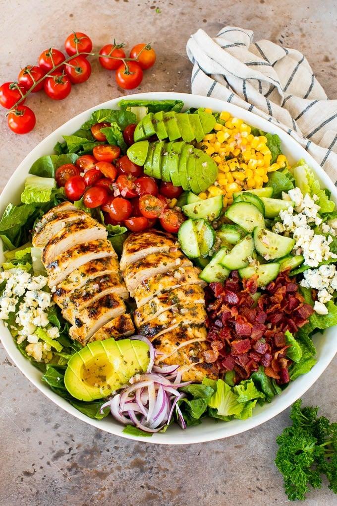 delicious and colorful salad with grilled chicken and avocado