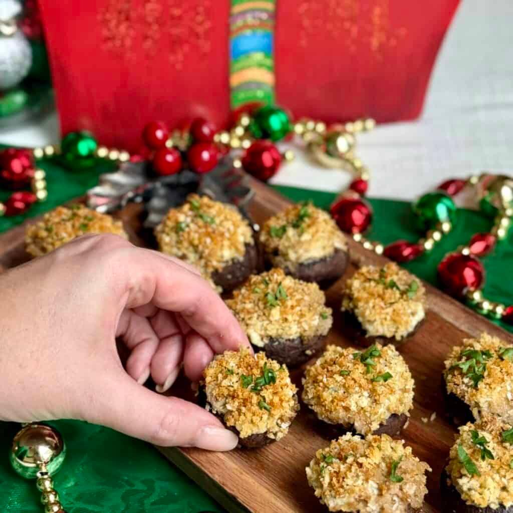 platter of golden-brown stuffed mushrooms on a festive holiday table