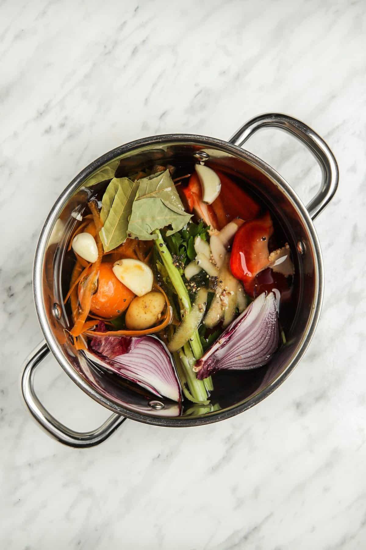 homemade zero waste vegetable broth simmering in pot