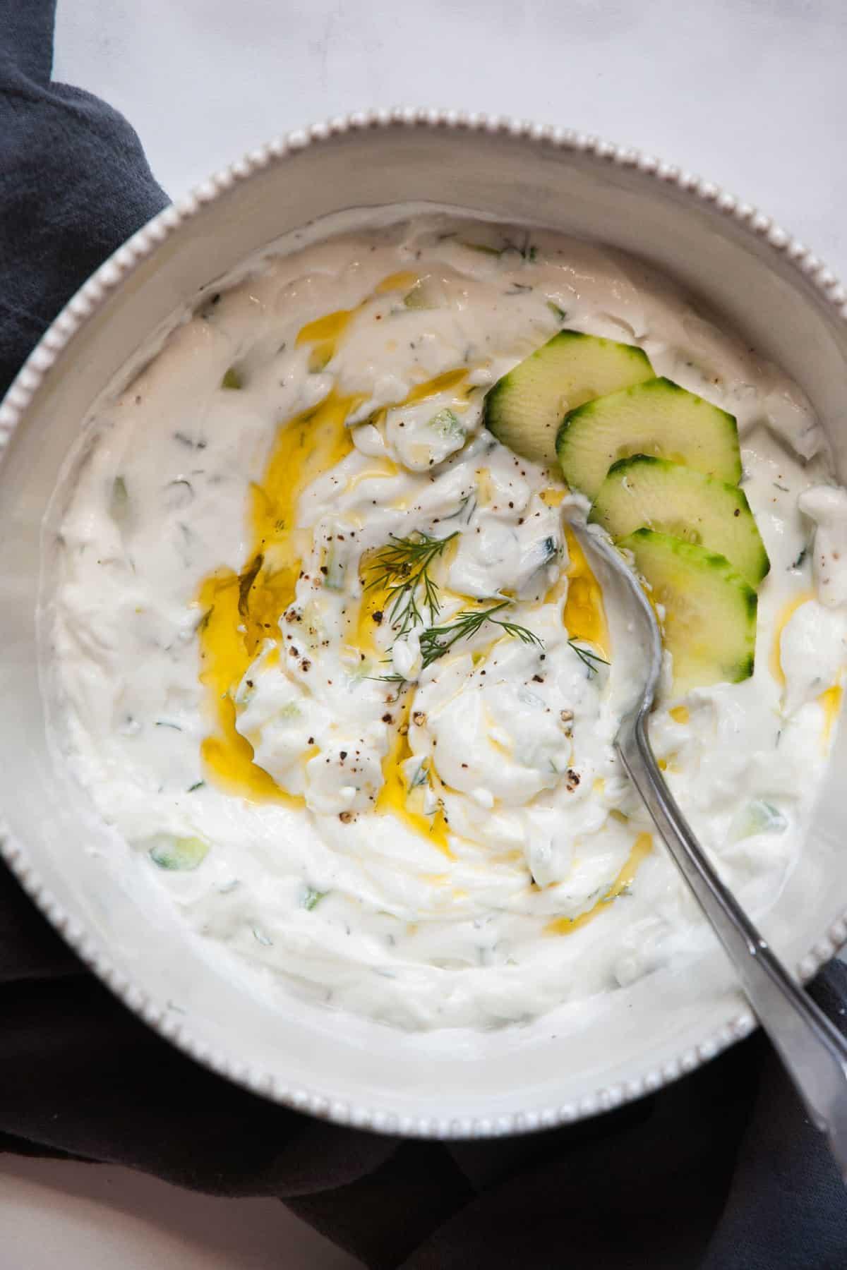 bowl of healthy tzatziki with cucumber and dill