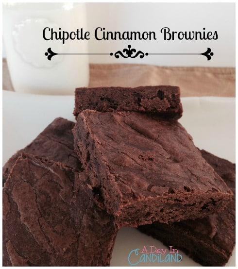 Close-up shot of a person taking a bite of a chipotle cinnamon brownie