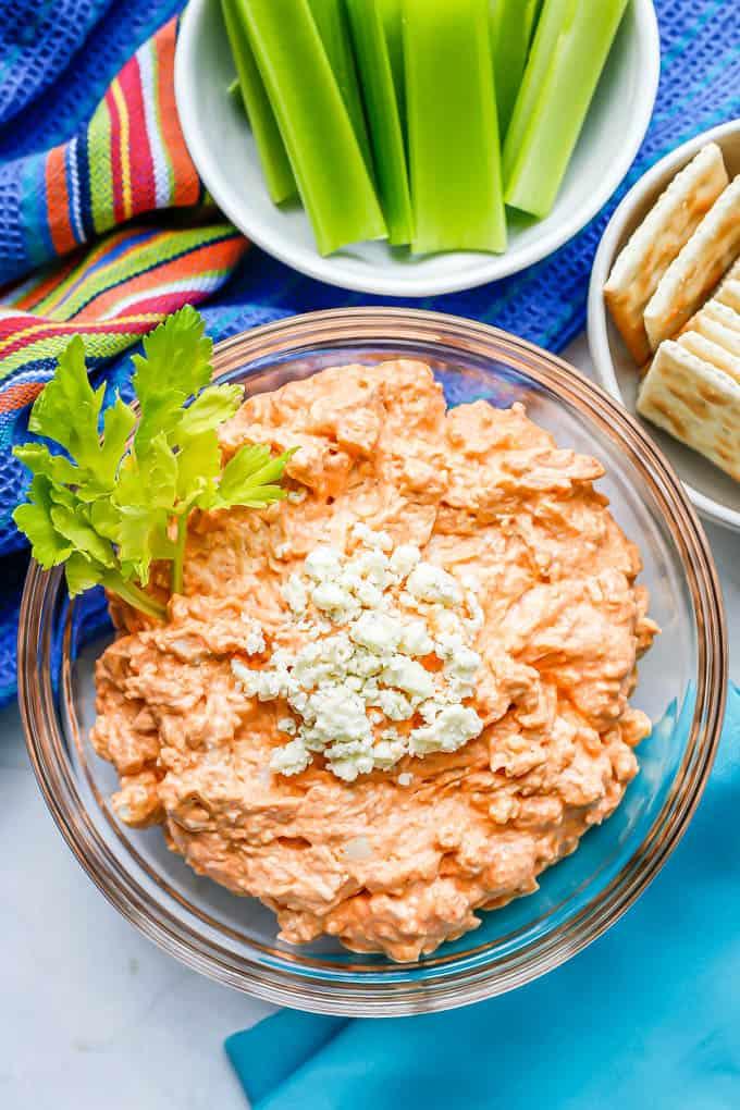 buffalo chicken dip with blue cheese crumbles and celery sticks