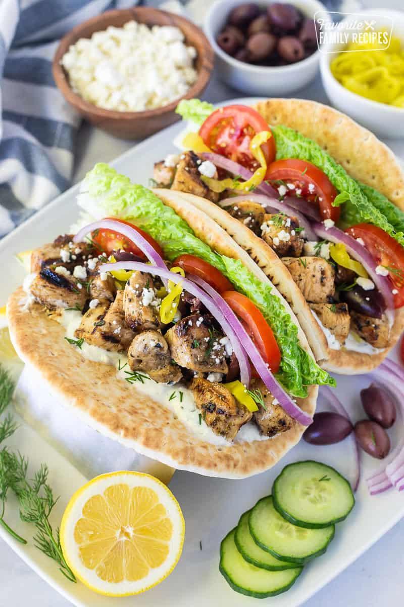 Ingredients for lemon herb chicken gyro laid out on a wooden table