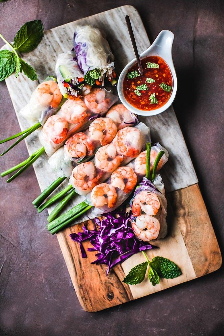 sautéed seafood summer rolls ingredients laid out on a table