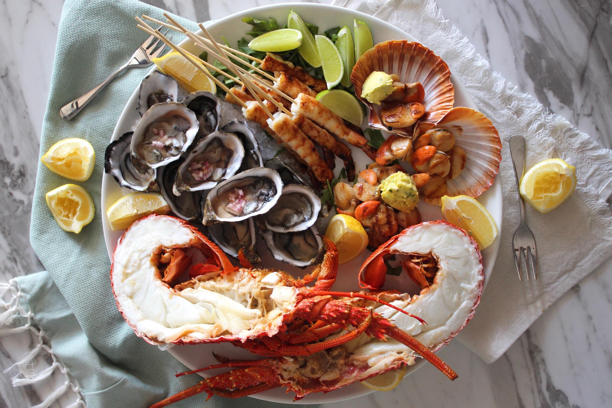 seafood platter with oysters, lobster, salmon and tuna