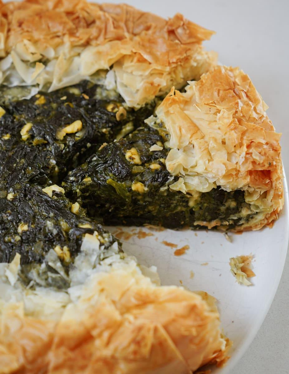 Close up shot of a golden spanakopita slice