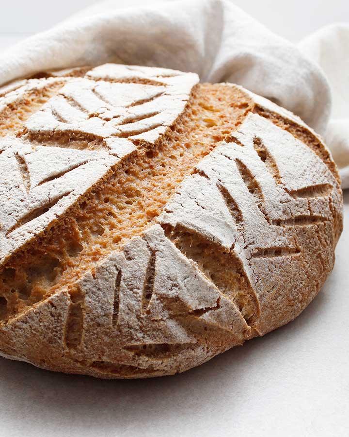 close-up of a sliced buckwheat chia seed sourdough loaf showing the crumb texture