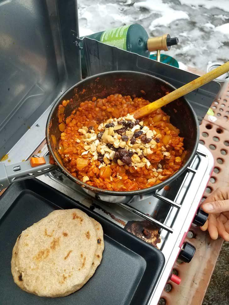spiced lentil roti being cooked on a tava