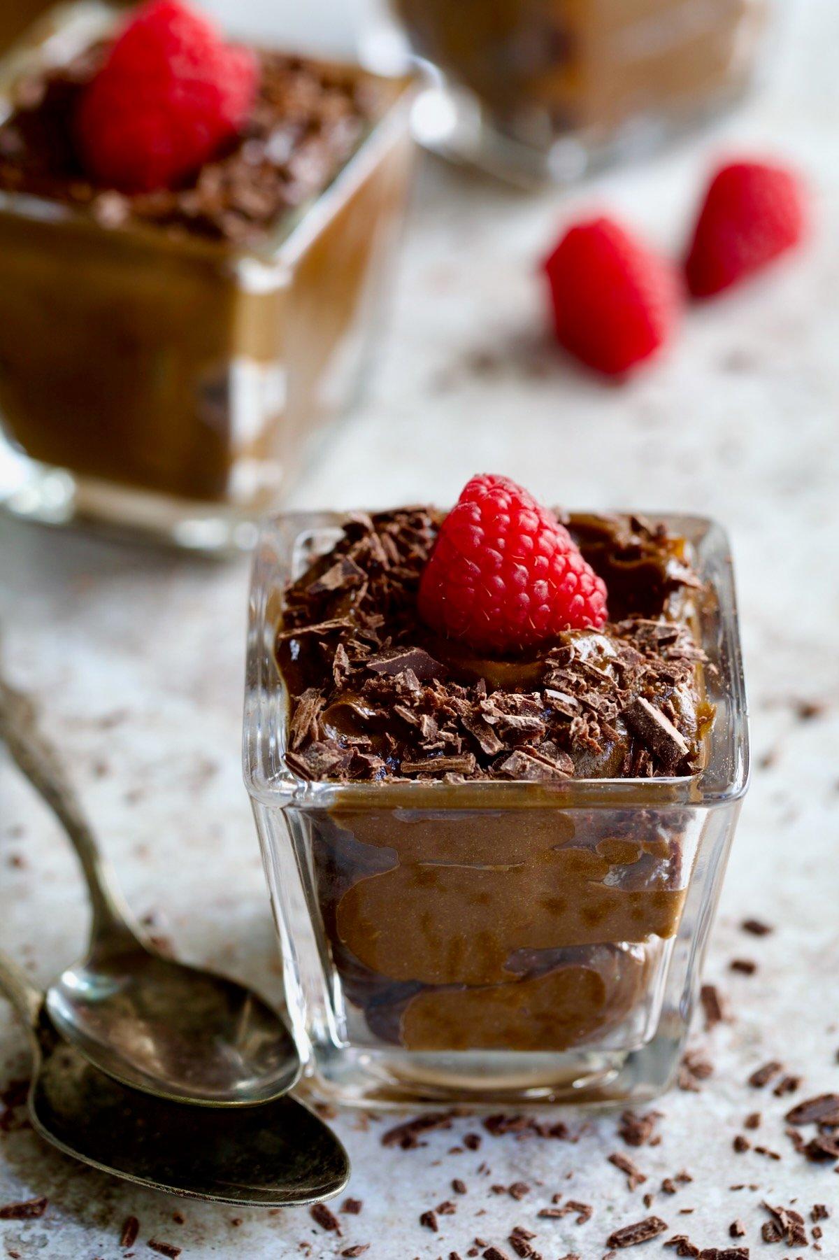 avocado mousse in a glass dish, garnished with chocolate shavings
