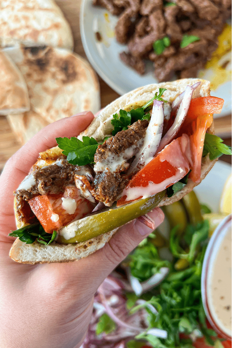 steak shawarma with sumac onions in a wrap