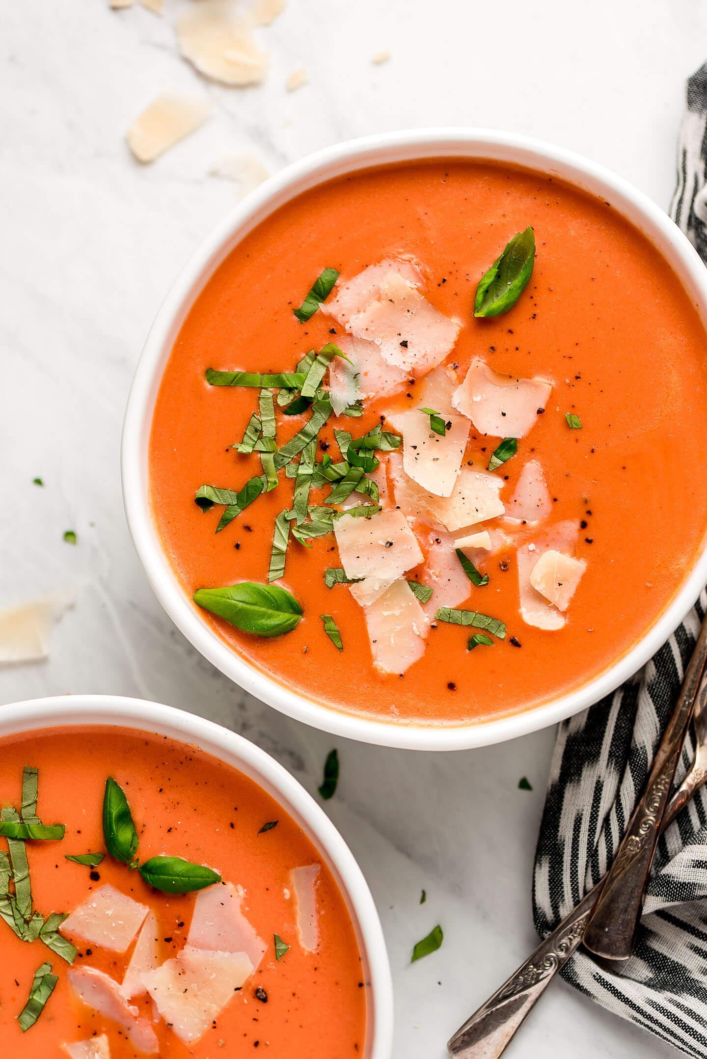 bowl of creamy tomato soup with garnish