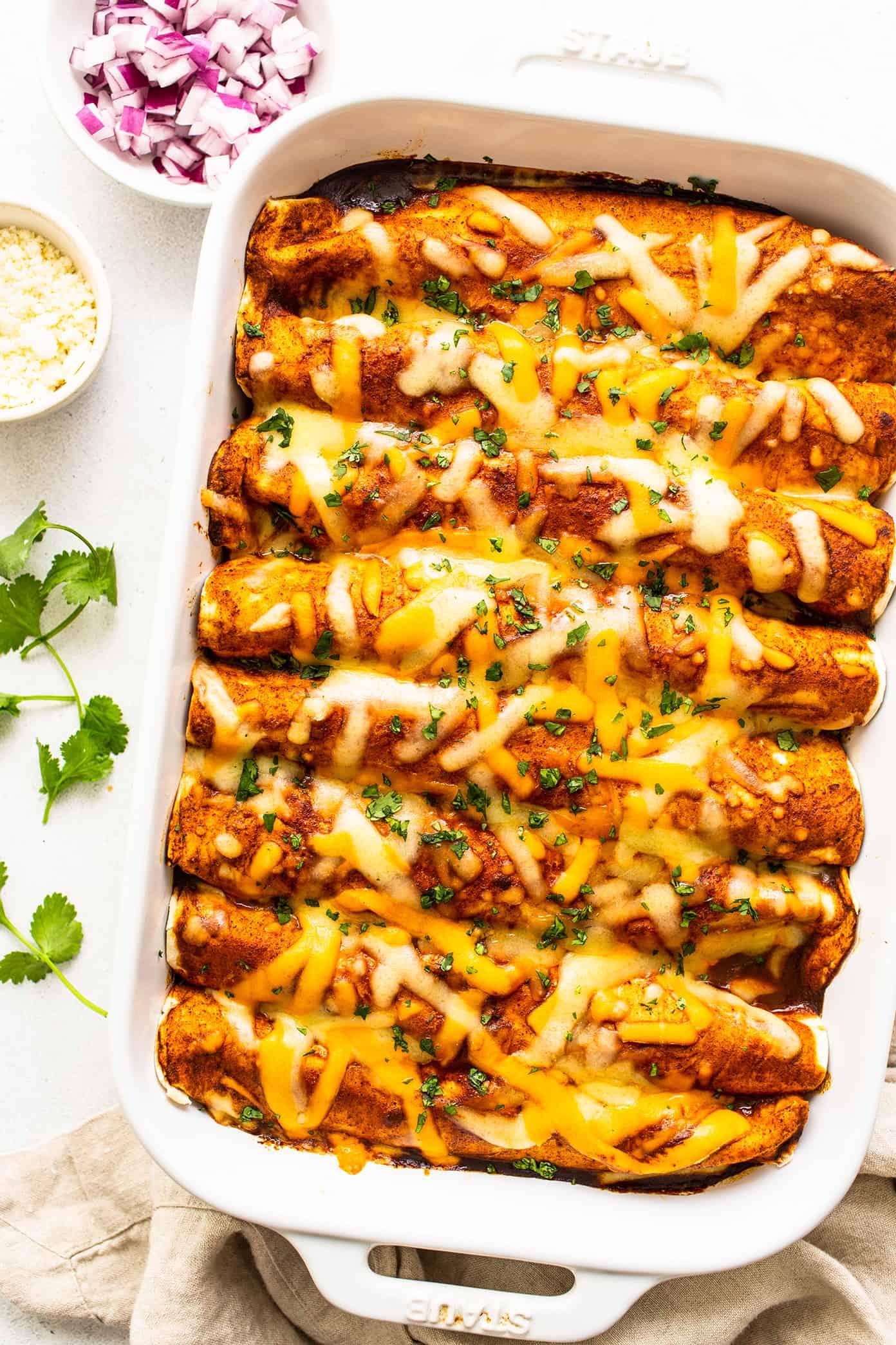 delicious beef and cheese enchiladas in a baking dish