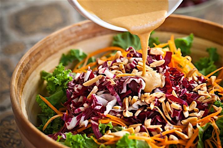 close-up of massaged kale leaves with ginger dressing