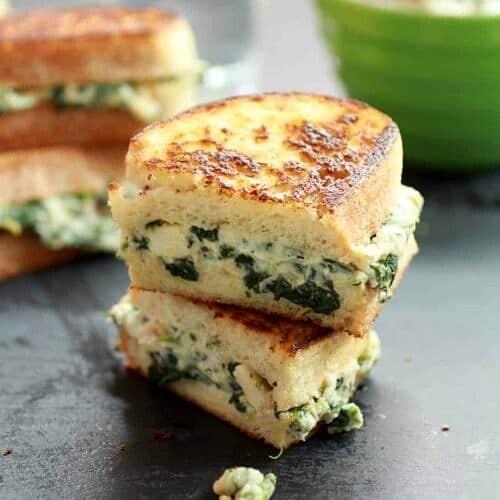 sourdough bread with spinach artichoke cheese melt on a plate