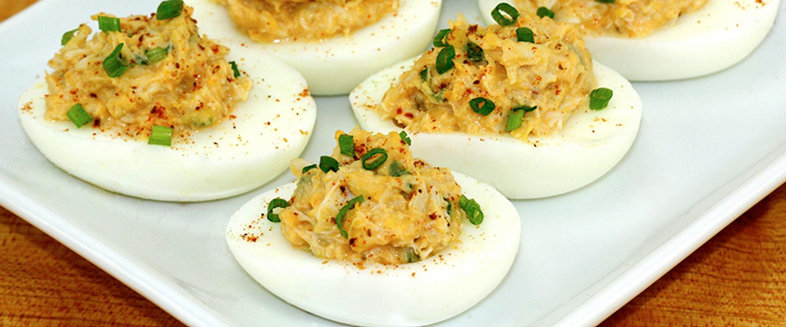 Close-up of a Crab Rangoon Deviled Egg showing the creamy filling and crab meat