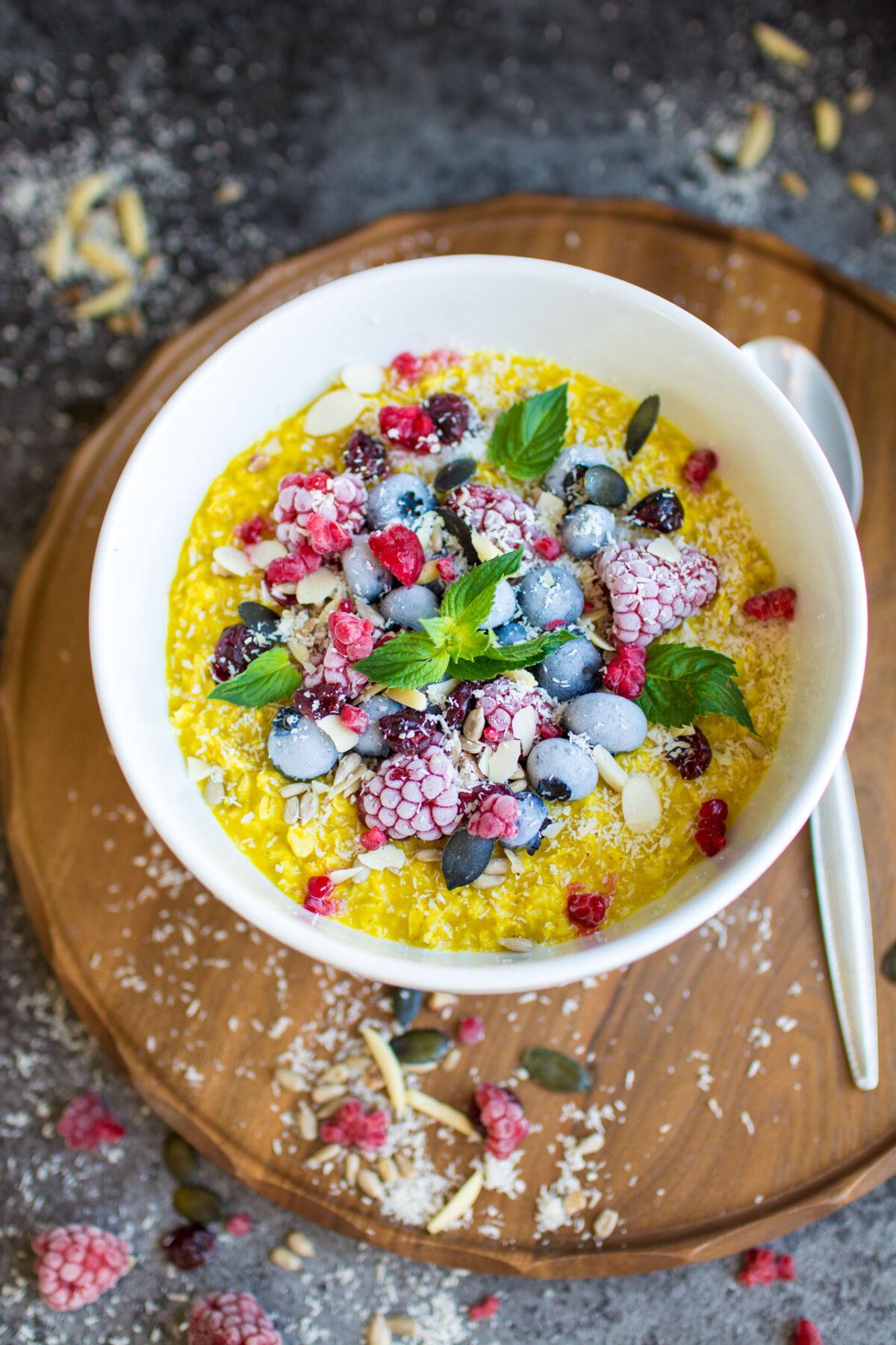 overhead shot of a vibrant bowl of tropical turmeric oatmeal
