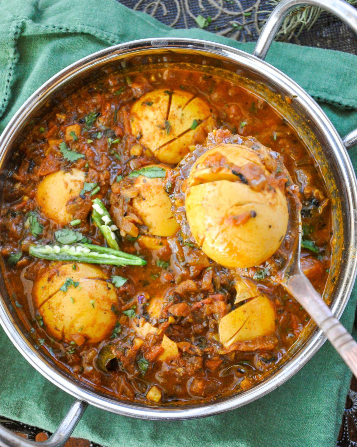 Cooking cumin spiced egg curry