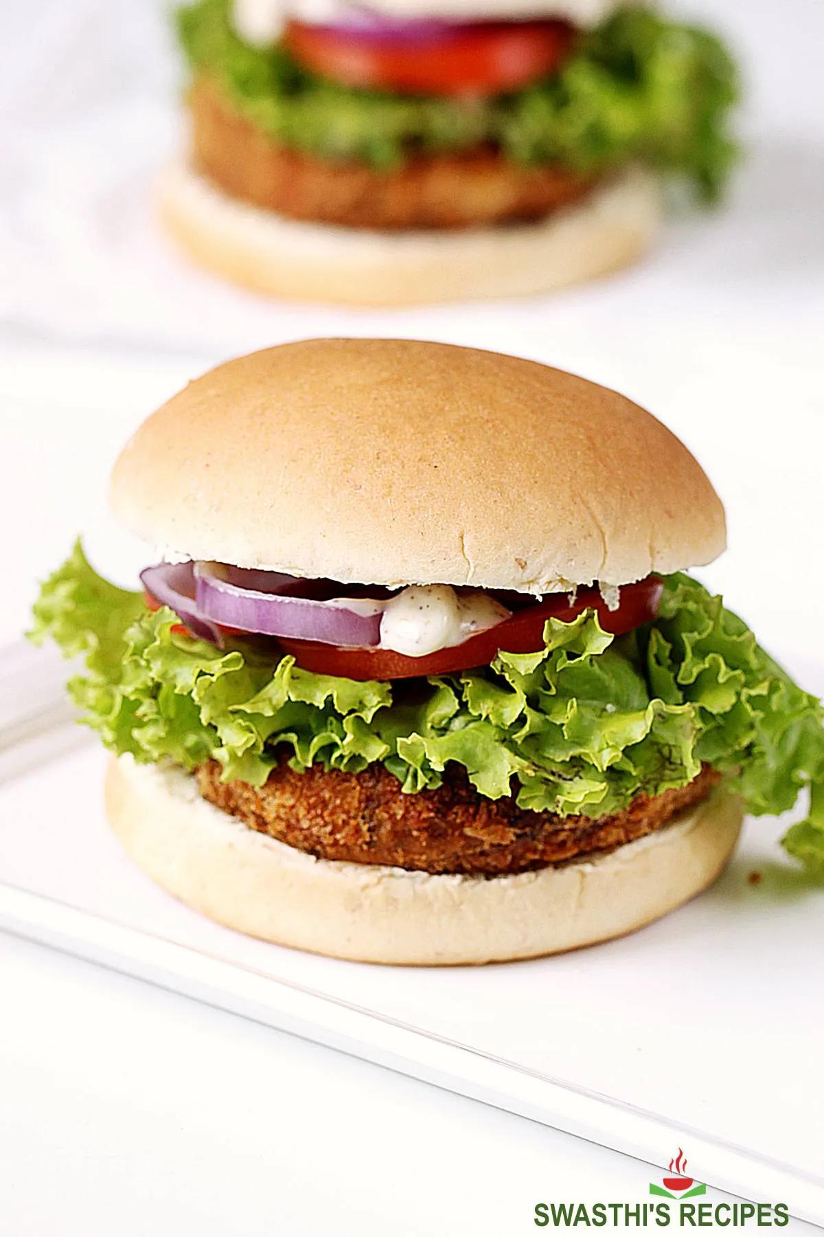 vegan burger with toppings on a toasted bun