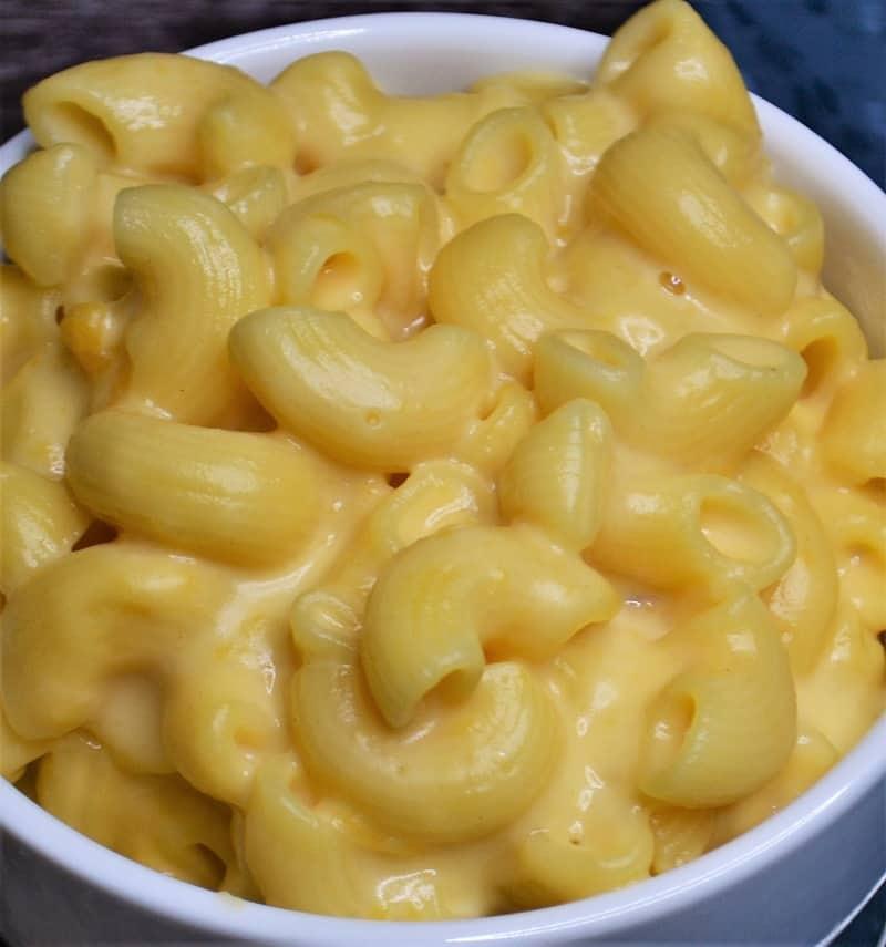 a close-up of a bowl of freshly made mac and cheese