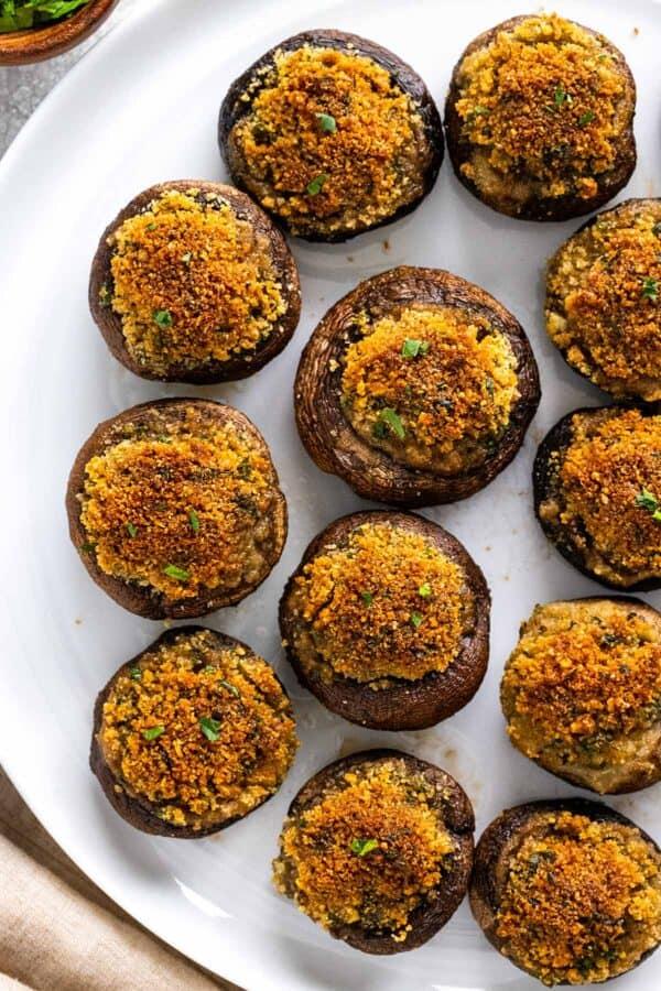 Overhead shot of baked falafel stuffed mushrooms on a baking sheet, golden brown and ready to be served