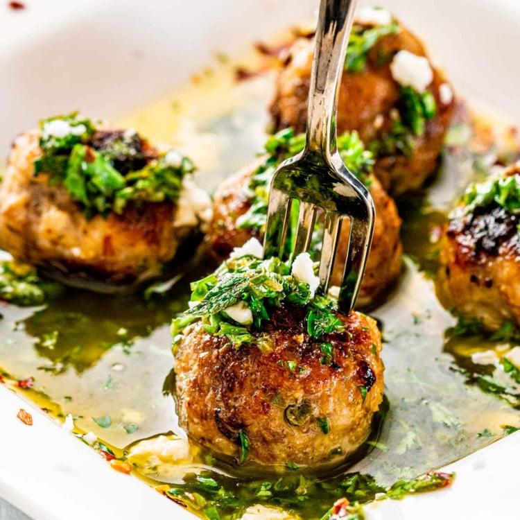 close up of Argentinian Köttbullar with Chimichurri Sauce on a plate