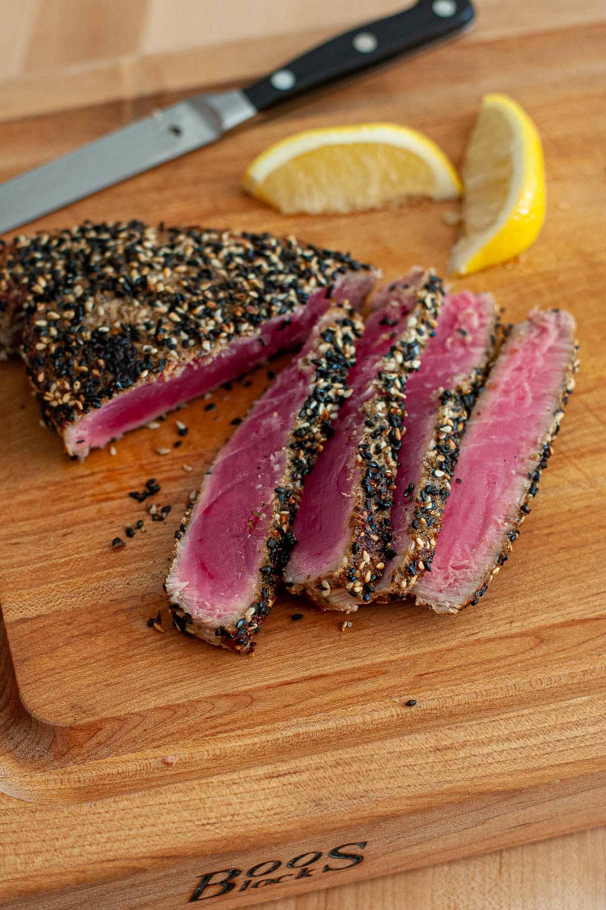 Close-up of a perfectly seared Ahi tuna steak with a light sear and raw interior.