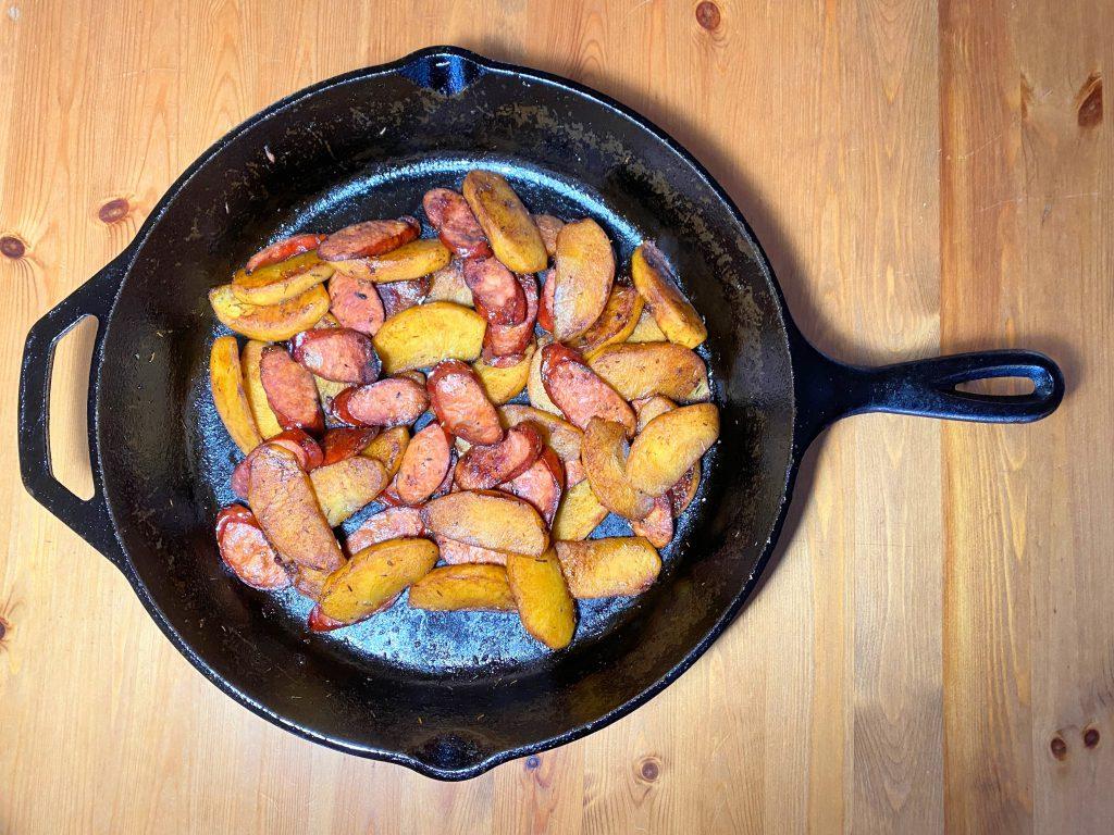 sautéed chorizo and apple in a skillet