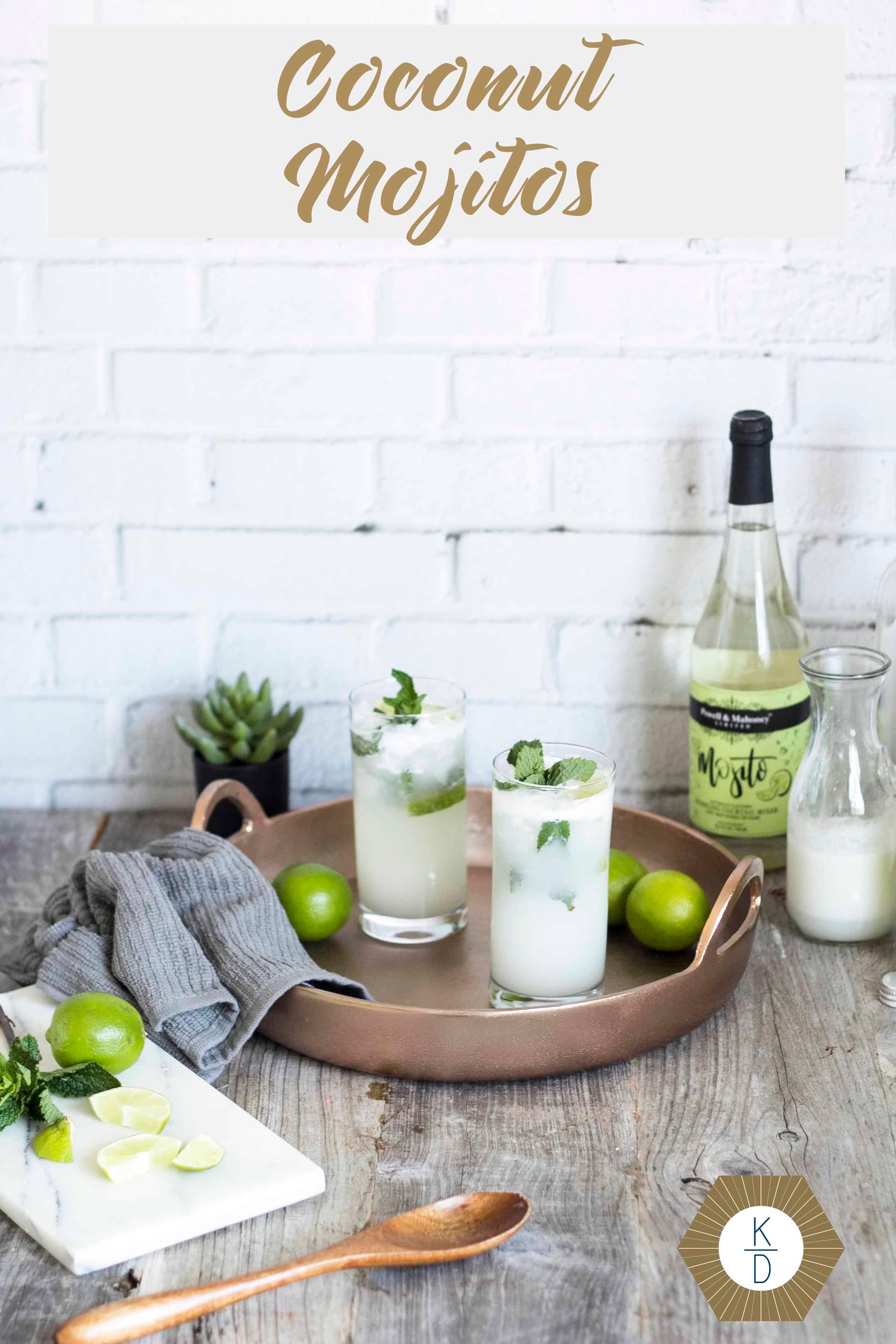 ingredients for coconut mojito laid out on a rustic wooden table with fairy lights