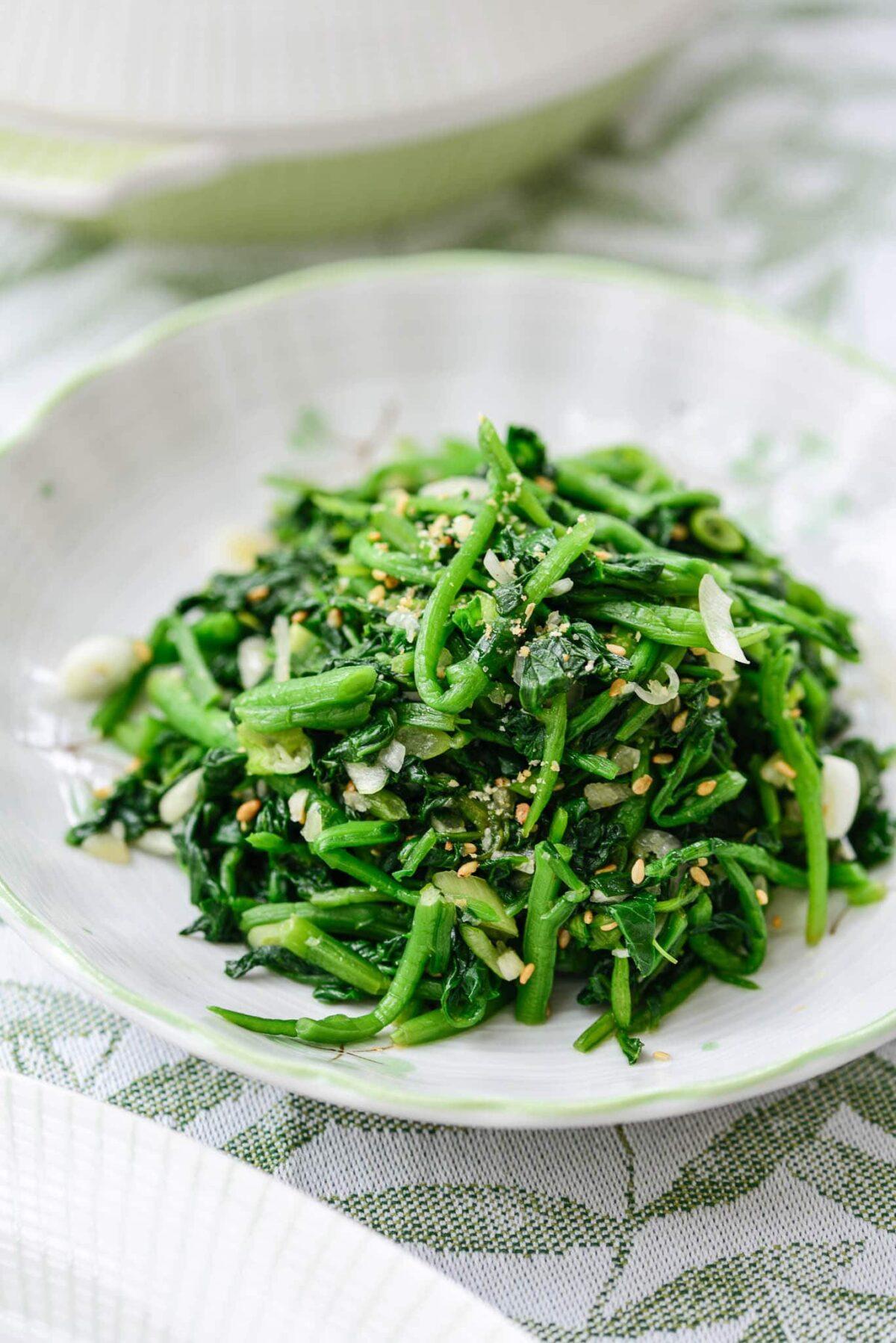 close up of steamed watercress with sesame oil and rice vinegar