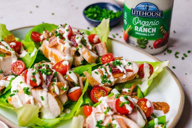 overhead shot of multiple ranch chicken lettuce wraps arranged on a plate