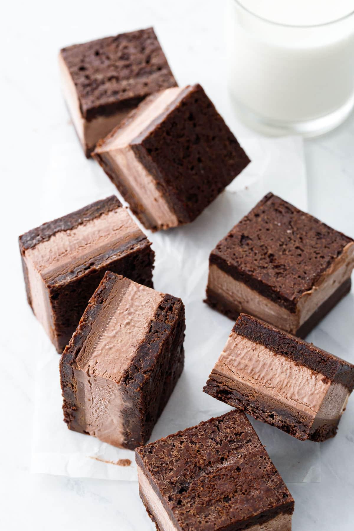 Chunks of fudgy brownies being folded into the ice cream base
