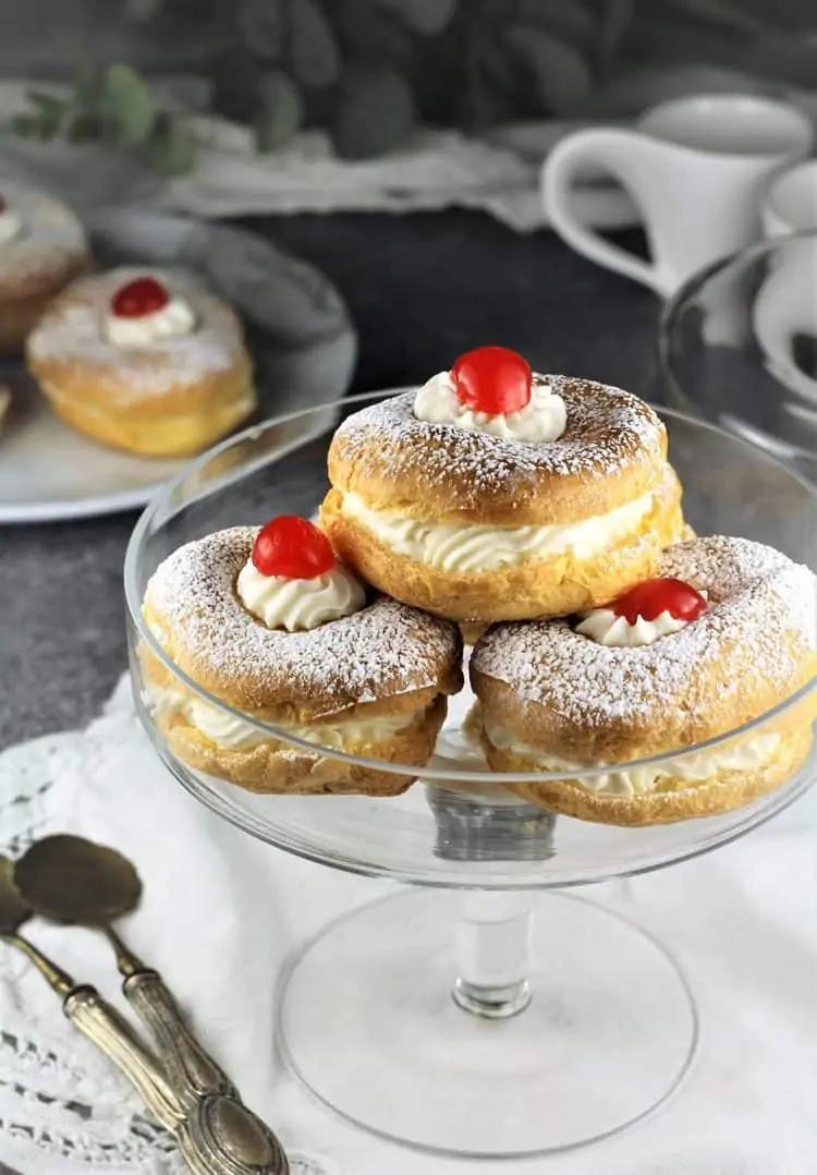 bagel zeppole topped with ricotta cream and powdered sugar