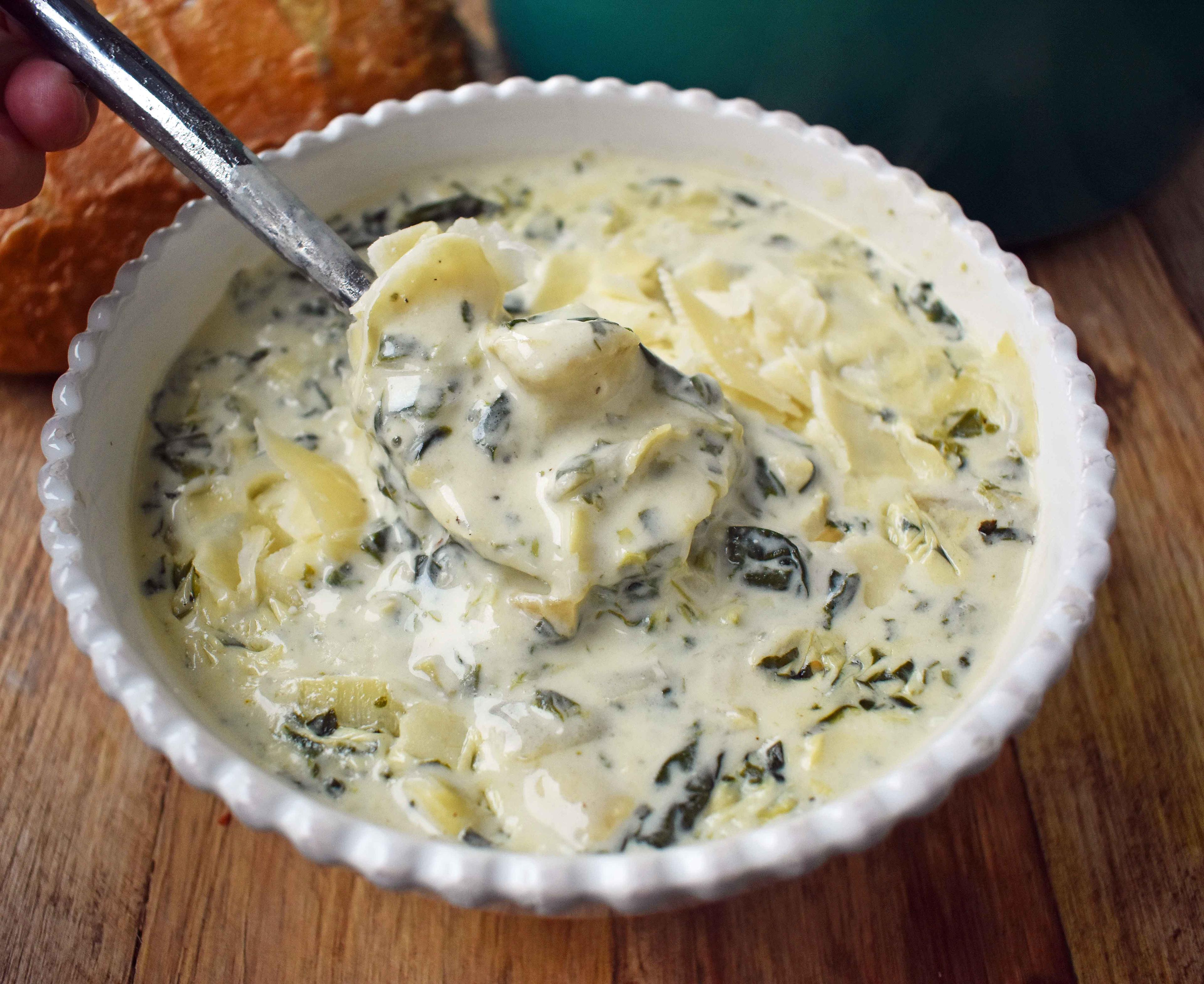 creamy spinach and artichoke soup in a bowl