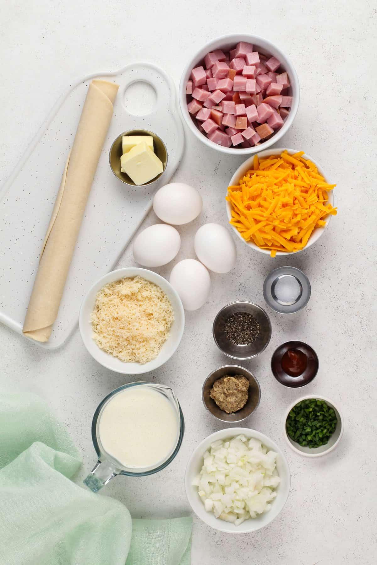 ingredients for quiche arranged on a kitchen counter