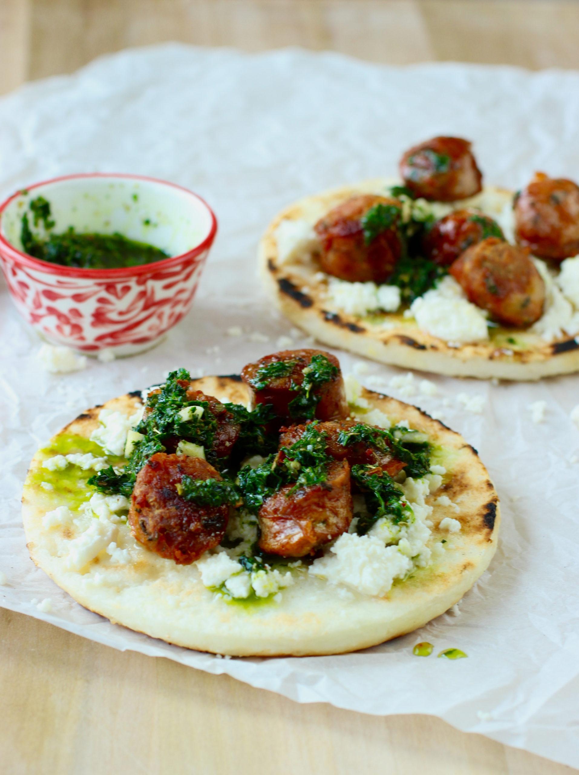 Smoked paprika arepas filled with chorizo and peppers, garnished with fresh cilantro