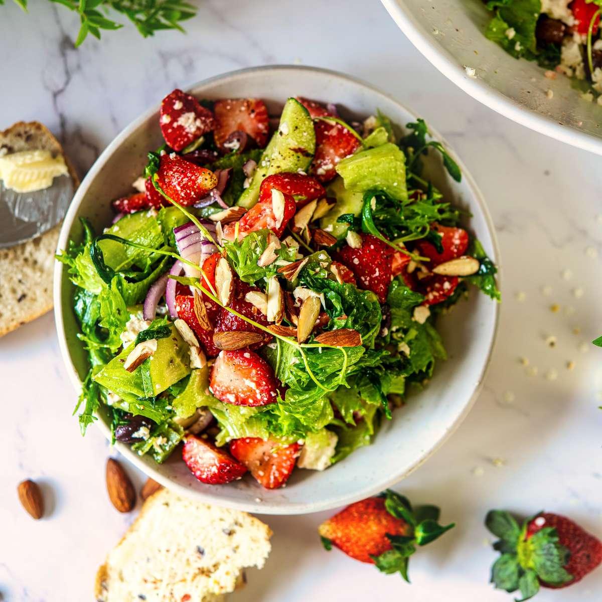 close up of a strawberry antipasto salad with focus on the contrasting colors and textures