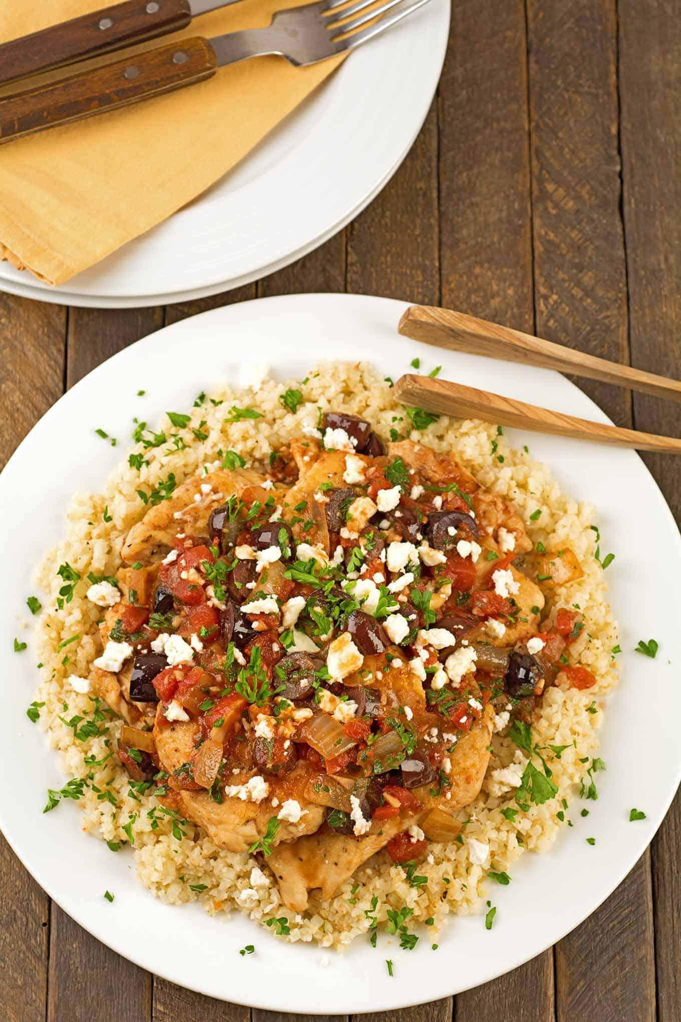 Close-up shot of Mediterranean chicken and cauliflower rice, showing the texture and ingredients