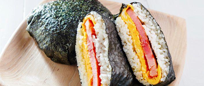 A vibrant and appetizing close-up shot of a Rice Riot Wrap, showcasing the colorful ingredients and texture of the filling.