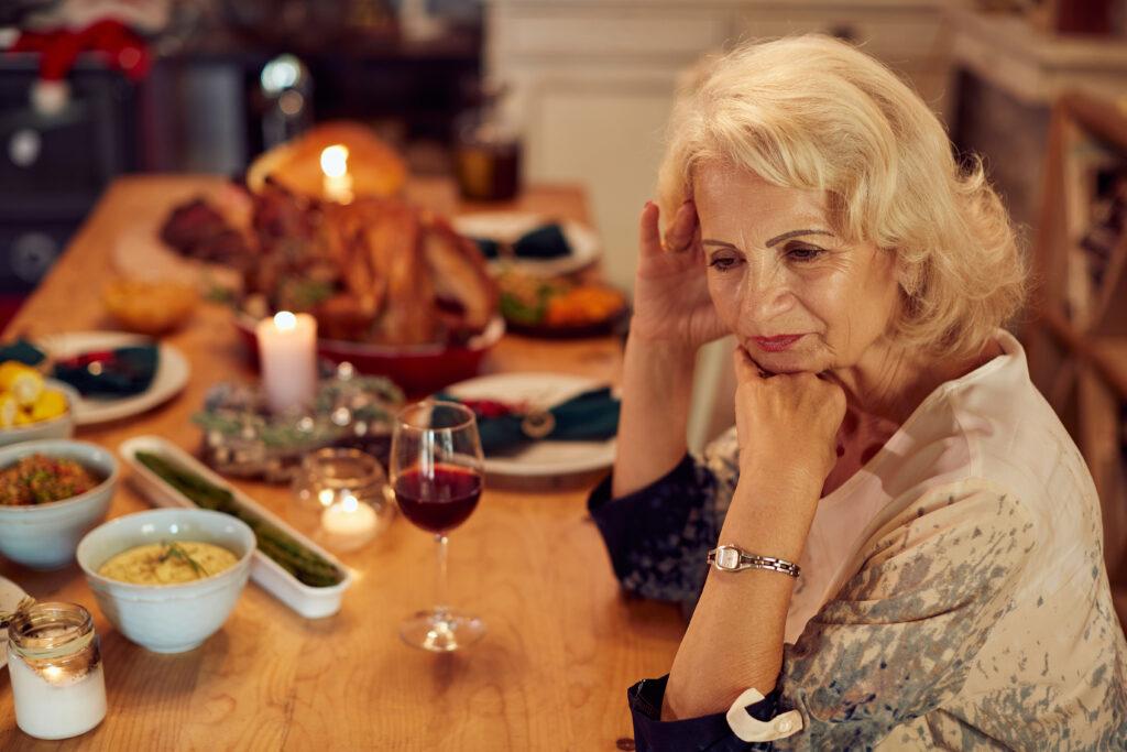 family looking disappointed at dry turkey on holiday table