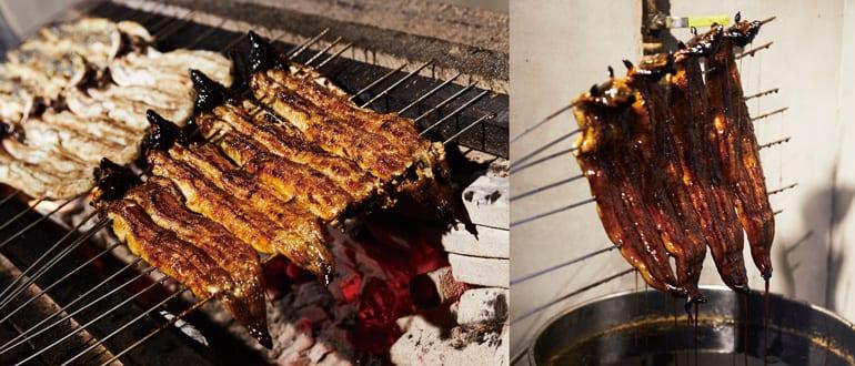 eel skewers being basted with sauce on a grill
