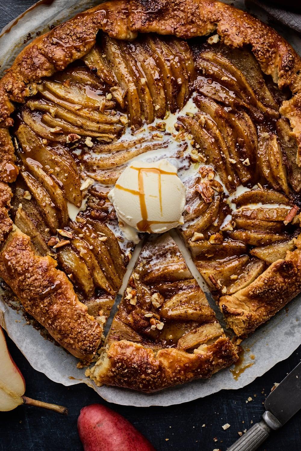 freshly baked spiced pear galette with steam rising, golden crust